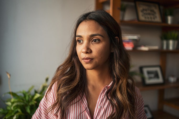 Young adult woman with a serious expression