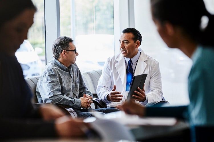 Actor portrayal of a doctor talking to his patient